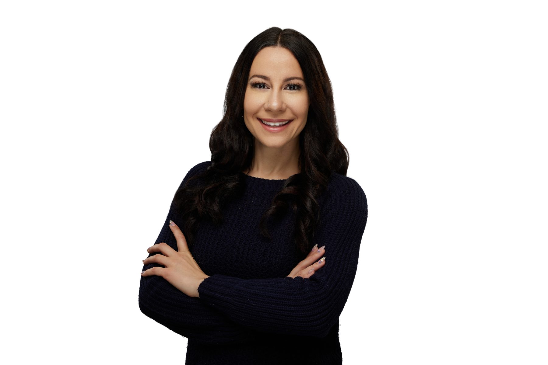 Bryanna Baptiste in a navy sweater with her arms crossed