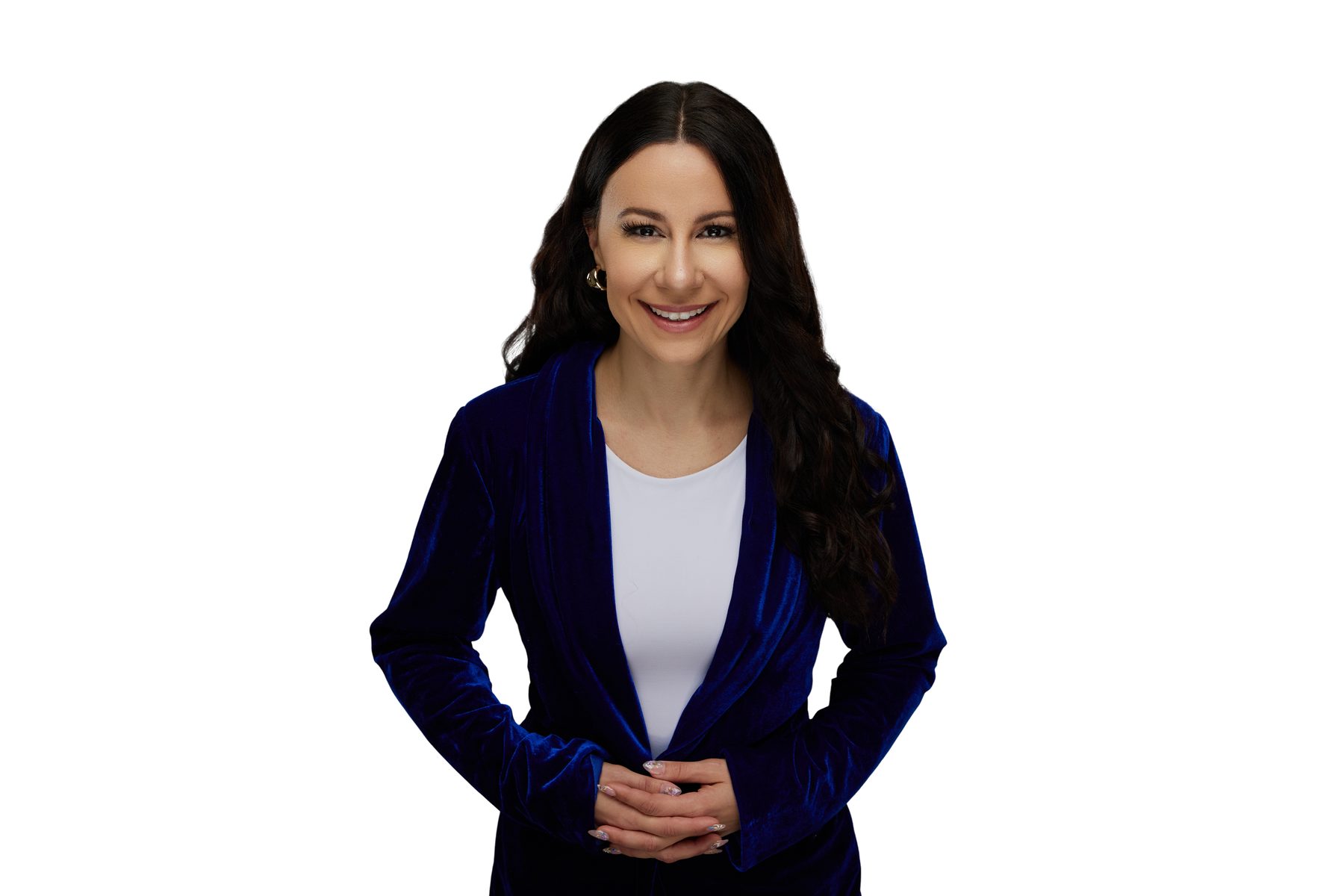 Bryanna Baptiste in a royal blue velvet blazer, photographed from the waist up